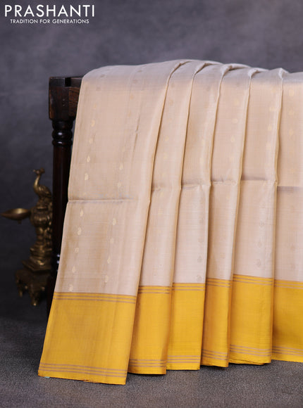 Pure soft silk saree beige and yellow with allover zari woven buttas and zari woven simple border