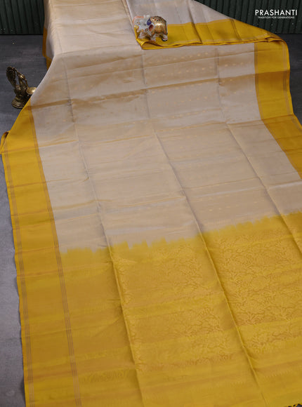 Pure soft silk saree beige and yellow with allover zari woven buttas and zari woven simple border