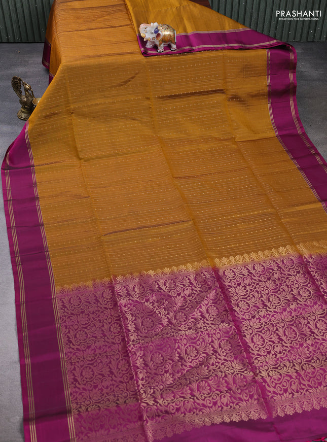 Pure soft silk saree dark mustard and magenta pink with allover zari weaves pattern and rettapet zari woven border