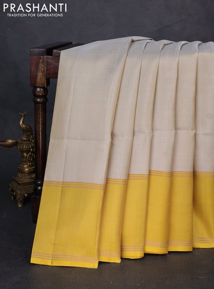 Pure soft silk saree elaichi green and yellow with allover zari woven buttas and rettapet zari woven border