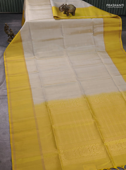 Pure soft silk saree elaichi green and yellow with allover zari woven buttas and rettapet zari woven border