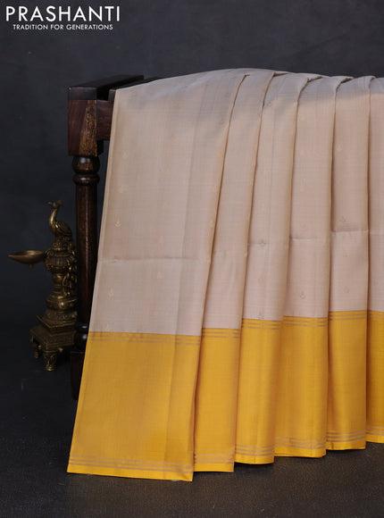 Pure soft silk saree grey and yellow with allover zari woven buttas and rettapet zari woven border
