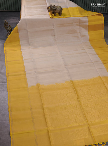 Pure soft silk saree grey and yellow with allover zari woven buttas and rettapet zari woven border