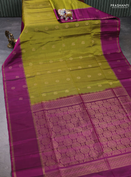 Pure soft silk saree mehendi green and magenta pink with allover zari woven buttas and rettapet zari woven butta border