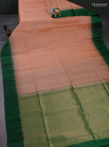 Pure soft silk saree peach shade and green with allover zari woven buttas and zari woven simple border