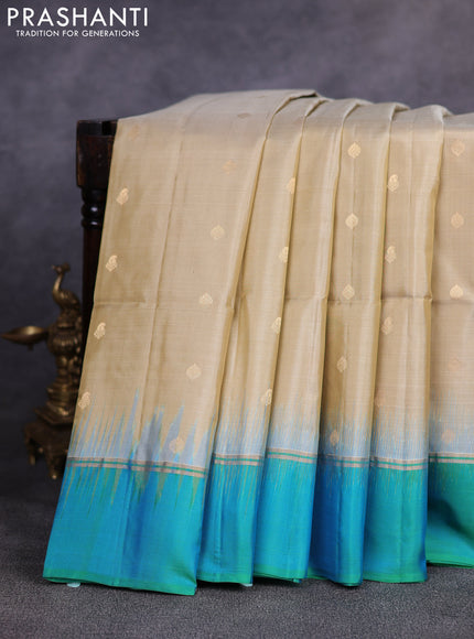 Pure soft silk saree beige and teal green with allover zari woven buttas and zari woven simple border