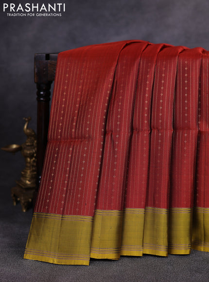Pure soft silk saree rust shade and mustard green with allover zari weaves pattern and rettapet zari woven border