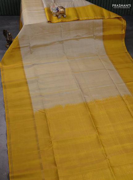 Pure soft silk saree beige and yellow with allover zari weaves pattern and rettapet zari woven border