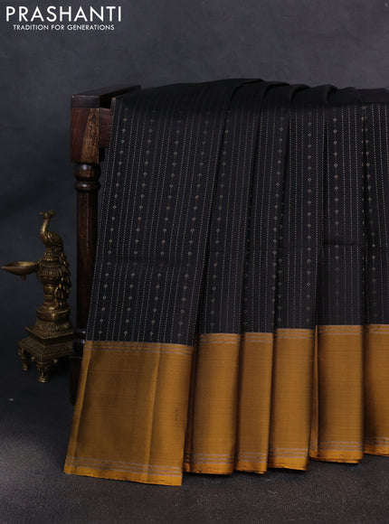 Pure soft silk saree black and mustard green with allover zari weaves pattern and rettapet zari woven border