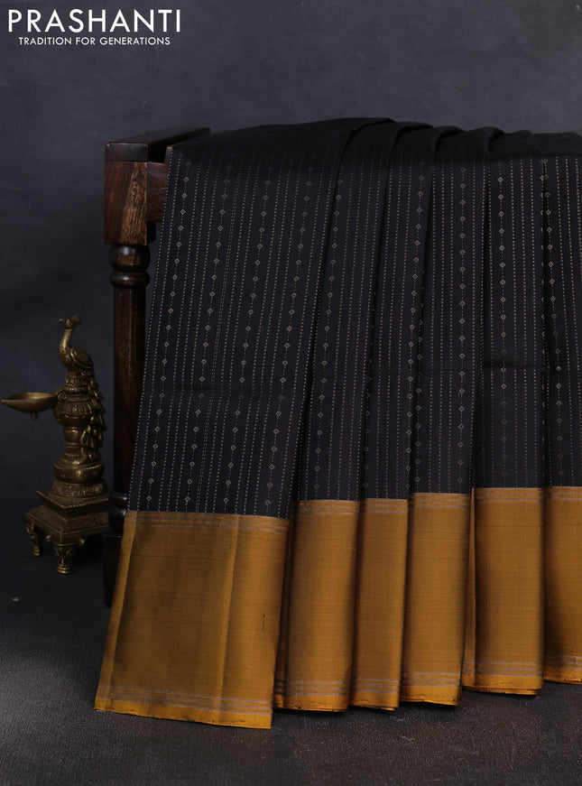 Pure soft silk saree black and mustard green with allover zari weaves pattern and rettapet zari woven border