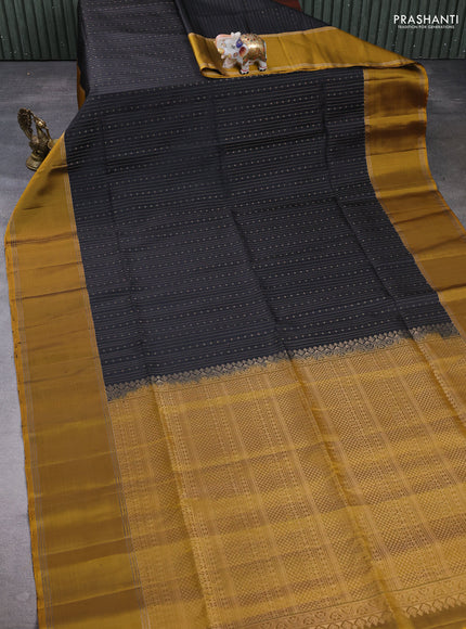 Pure soft silk saree black and mustard green with allover zari weaves pattern and rettapet zari woven border