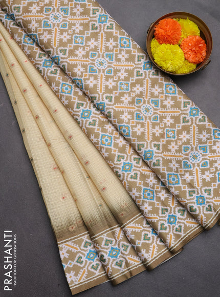 Art kota saree pale yellow and mehendi green with allover zari woven buttas and temple design ikat printed border