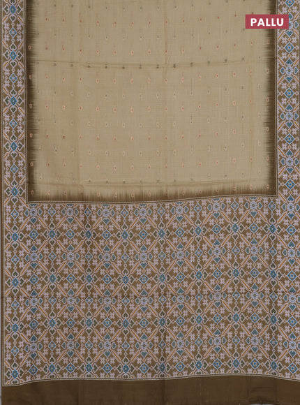 Art kota saree pale yellow and mehendi green with allover zari woven buttas and temple design ikat printed border