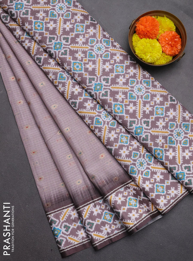 Art kota saree pastel pink shade and brown with allover zari woven buttas and temple design ikat printed border