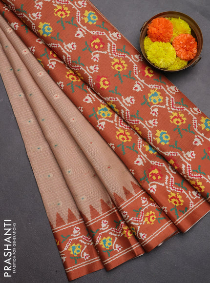 Art kota saree pastel orange and rustic orange with allover zari woven buttas and temple design ikat printed border