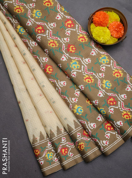 Art kota saree pale yellow and mehendi green with allover zari woven buttas and temple design ikat printed border