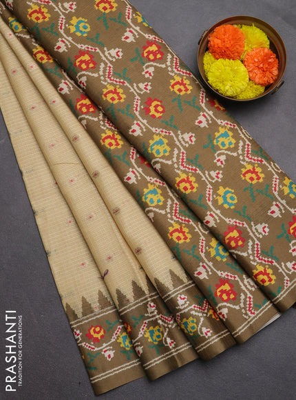 Art kota saree pale yellow and mehendi green with allover zari woven buttas and temple design ikat printed border