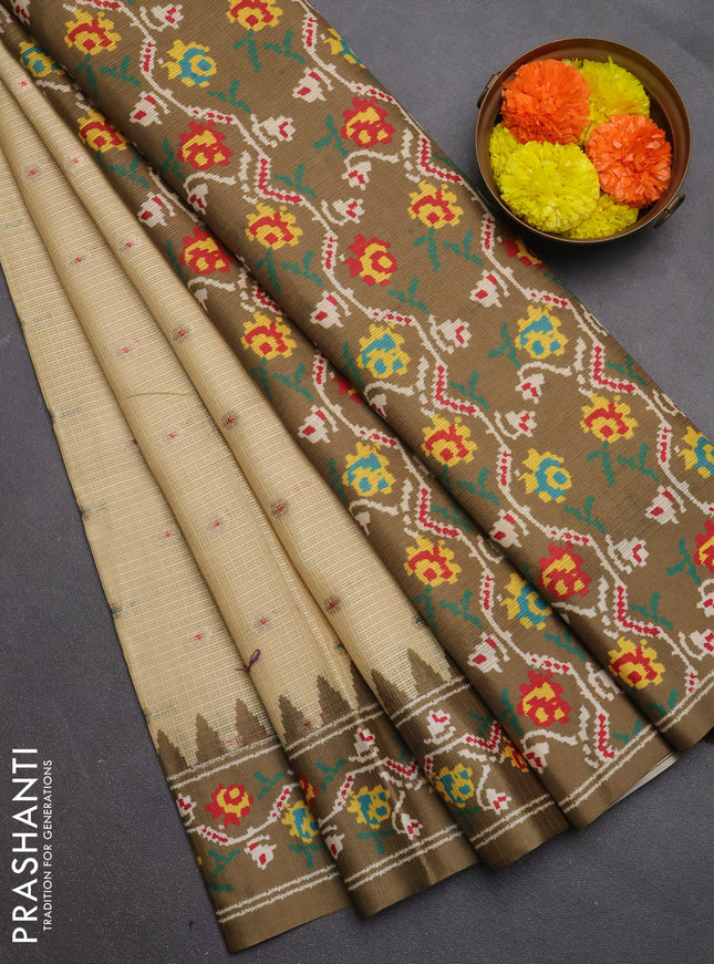 Art kota saree pale yellow and mehendi green with allover zari woven buttas and temple design ikat printed border