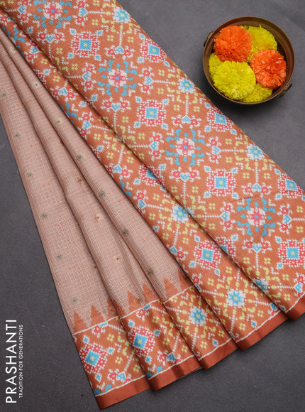 Art kota saree pastel orange and rustic orange with allover zari woven buttas and temple design ikat printed border