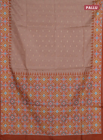 Art kota saree pastel orange and rustic orange with allover zari woven buttas and temple design ikat printed border