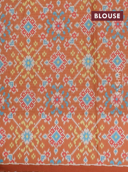 Art kota saree pastel orange and rustic orange with allover zari woven buttas and temple design ikat printed border