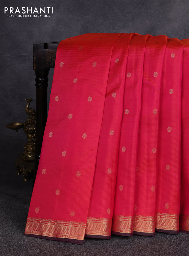 Pure kanchipuram silk saree dual shade of pinkish orange and green with allover zari woven buttas and small zari woven border