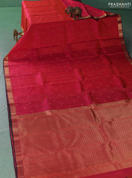 Pure kanchipuram silk saree dual shade of pinkish orange and green with allover zari woven buttas and small zari woven border