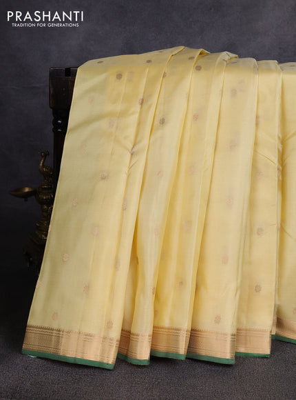Pure kanchipuram silk saree cream and green with zari woven buttas and small zari woven border