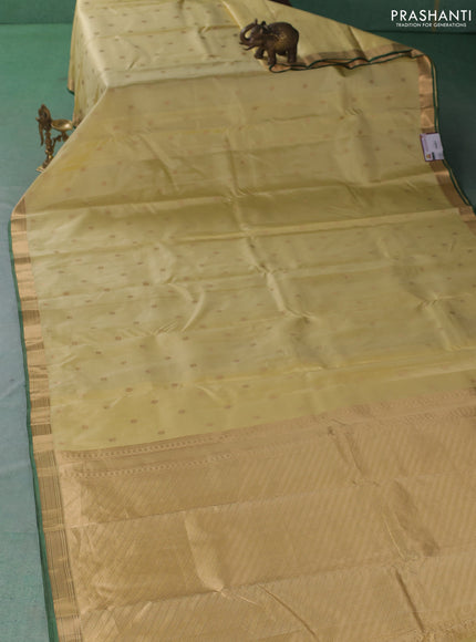 Pure kanchipuram silk saree cream and green with zari woven buttas and small zari woven border