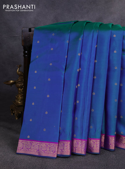 Pure kanchipuram silk saree dual shade of bluish green and pink with allover zari woven buttas and zari woven border