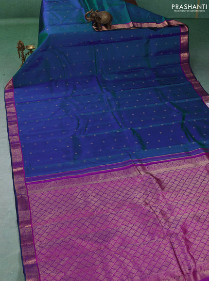 Pure kanchipuram silk saree dual shade of bluish green and pink with allover zari woven buttas and zari woven border