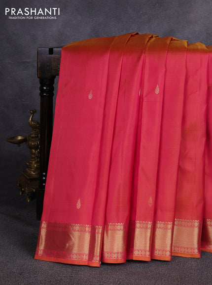 Pure kanchipuram silk saree dual shade of pinkish orange with zari woven buttas and zari woven border