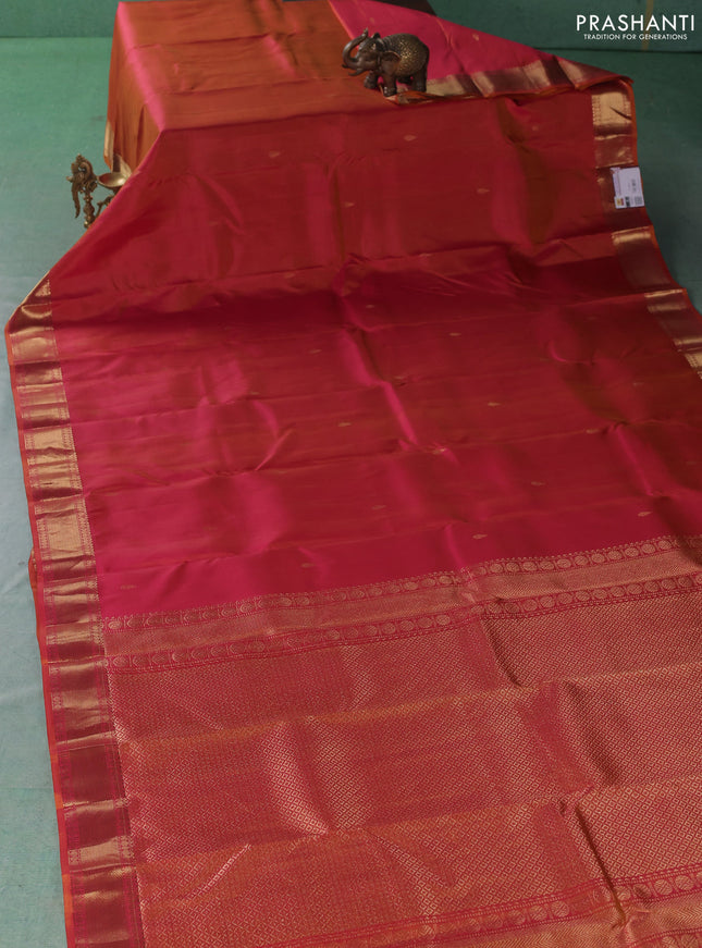 Pure kanchipuram silk saree dual shade of pinkish orange with zari woven buttas and zari woven border