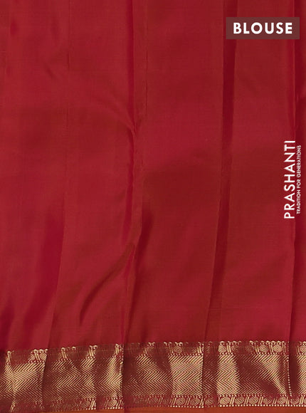 Pure kanchipuram silk saree dual shade of pinkish orange with zari woven buttas and zari woven border