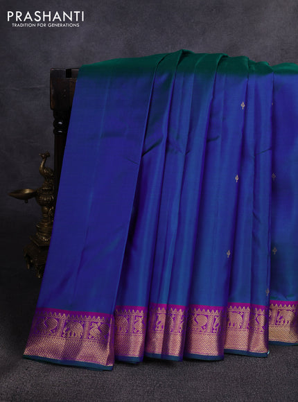 Pure kanchipuram silk saree dual shade of bluish green and purple with zari woven buttas and zari woven border