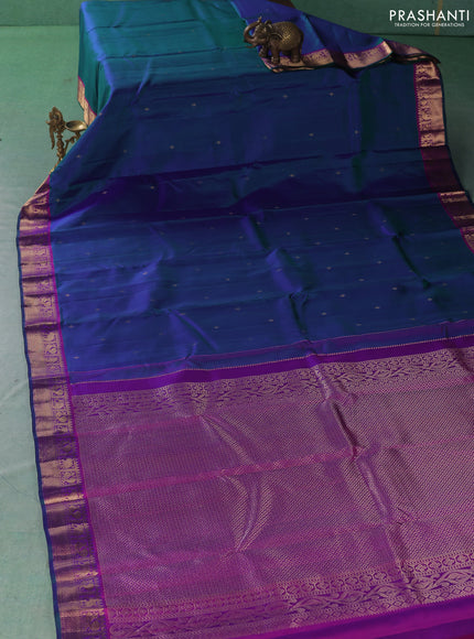 Pure kanchipuram silk saree dual shade of bluish green and purple with zari woven buttas and zari woven border