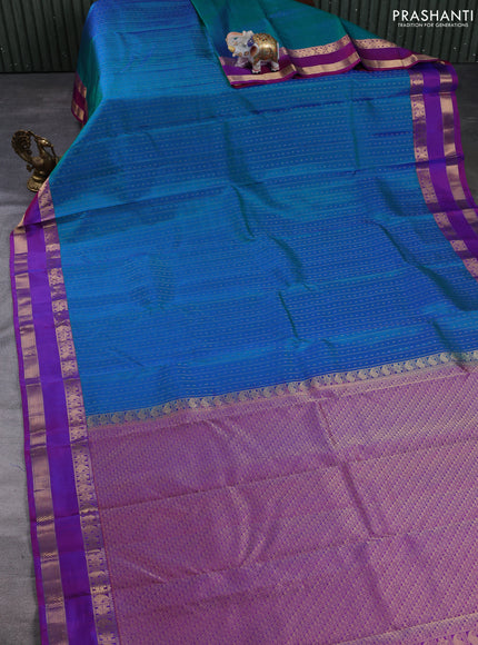 Pure kanchipuram silk saree dual shade of bluish green and purple with allover zari weaves & buttas and rettapet zari woven border