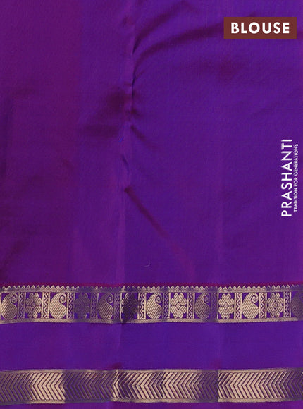 Pure kanchipuram silk saree dual shade of bluish green and purple with allover zari weaves & buttas and rettapet zari woven border
