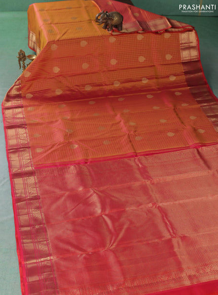 Pure kanchipuram silk saree dual shade of pinkish orange with allover zari checks & buttas and zari woven border