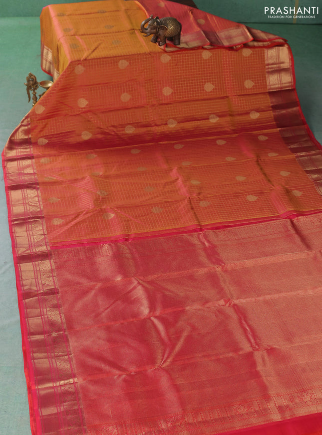 Pure kanchipuram silk saree dual shade of pinkish orange with allover zari checks & buttas and zari woven border