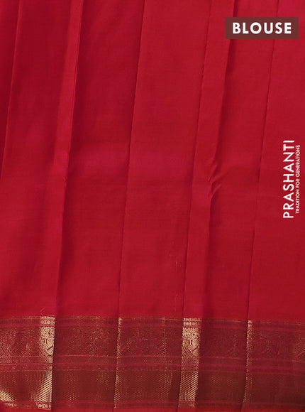 Pure kanchipuram silk saree dual shade of pinkish orange with allover zari checks & buttas and zari woven border