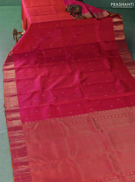 Pure kanchipuram silk saree dual shade of pinkish orange with allover zari woven buttas and zari woven border