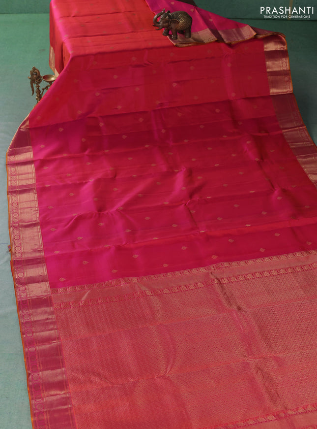 Pure kanchipuram silk saree dual shade of pinkish orange with allover zari woven buttas and zari woven border