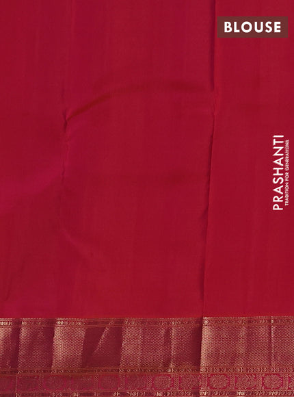 Pure kanchipuram silk saree dual shade of pinkish orange with allover zari woven buttas and zari woven border