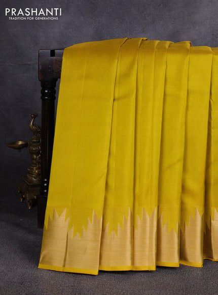 Pure kanchipuram silk saree lime yellow with plain body and temple design zari woven border