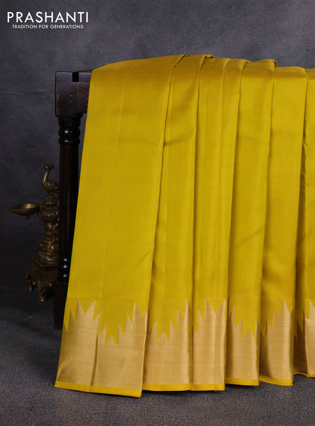 Pure kanchipuram silk saree lime yellow with plain body and temple design zari woven border