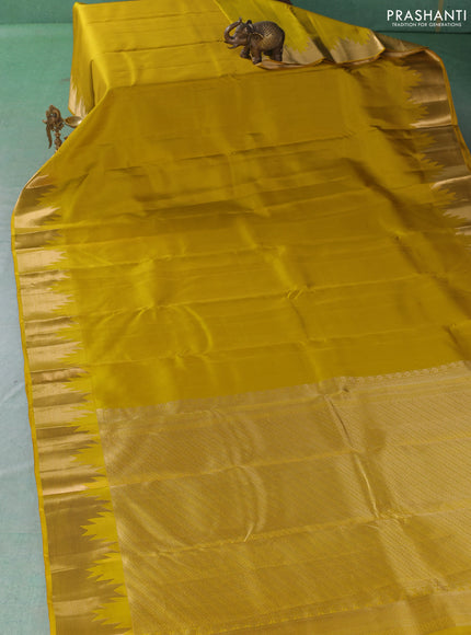 Pure kanchipuram silk saree lime yellow with plain body and temple design zari woven border