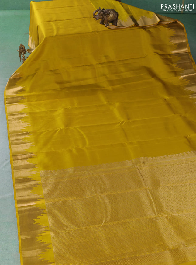 Pure kanchipuram silk saree lime yellow with plain body and temple design zari woven border