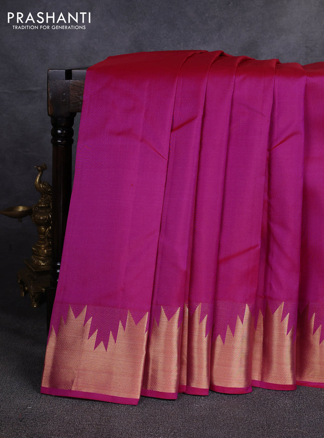 Pure kanchipuram silk saree pink with plain body and temple design zari woven border