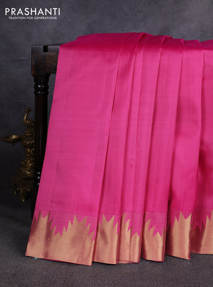 Pure kanchipuram silk saree pink with plain body and temple design zari woven border